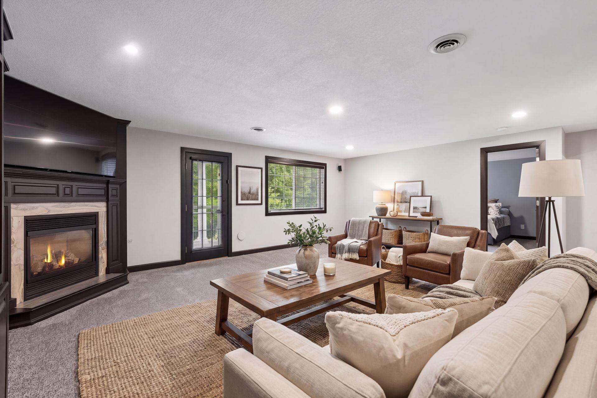 A corner gas fireplace, recessed lighting, and built-in Bose speakers create an inviting setting for movie nights and entertaining. The lower level also features convenient motion-sensor lighting and a built-in gun safe located in the hallway.