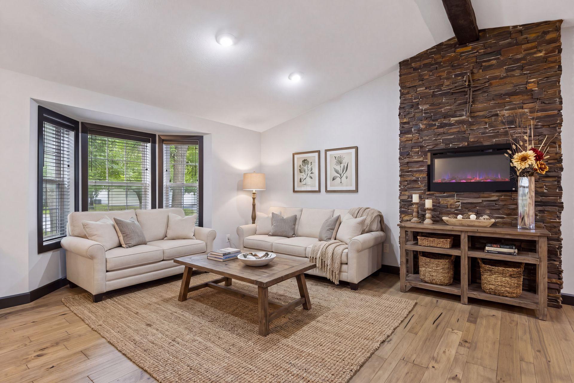 The beautiful acacia wood floors flow through the main living spaces, while the vaulted ceiling with a faux wood beam adds customized character.