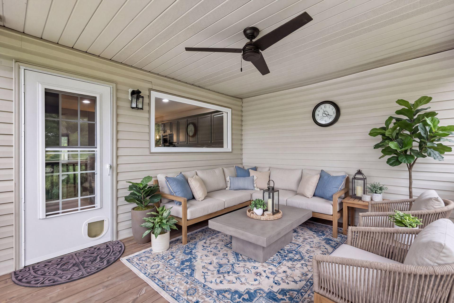 Accessible directly from the kitchen, the covered deck features a ceiling fan and plenty of room for comfortable outdoor seating.