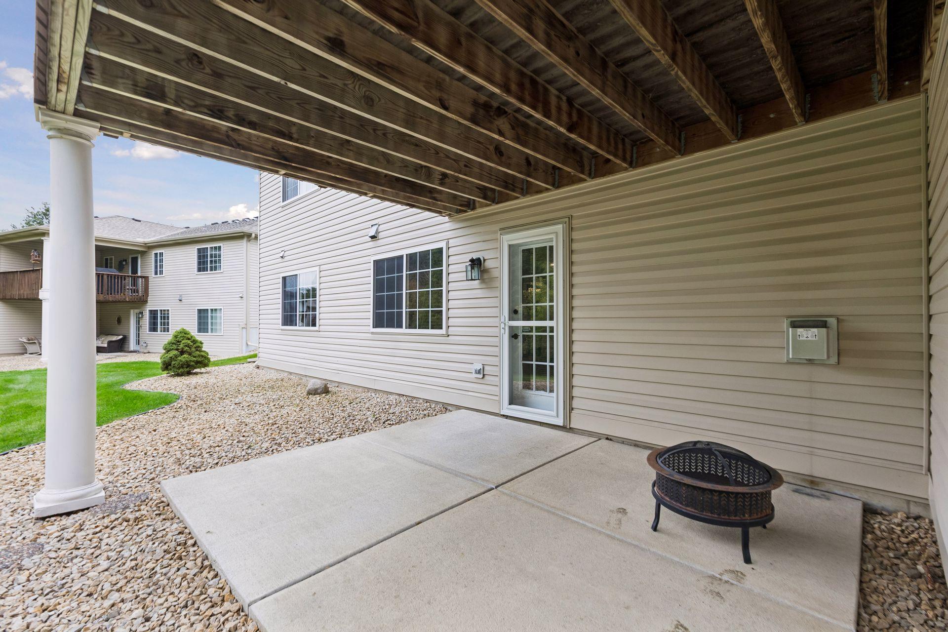 Walk out from the lower-level family room to a covered patio offering a sheltered space to relax and enjoy the outdoors.