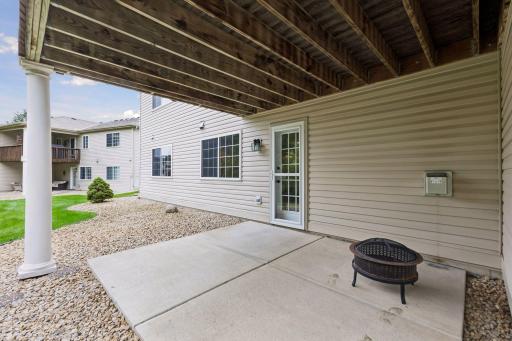 Walk out from the lower-level family room to a covered patio offering a sheltered space to relax and enjoy the outdoors.