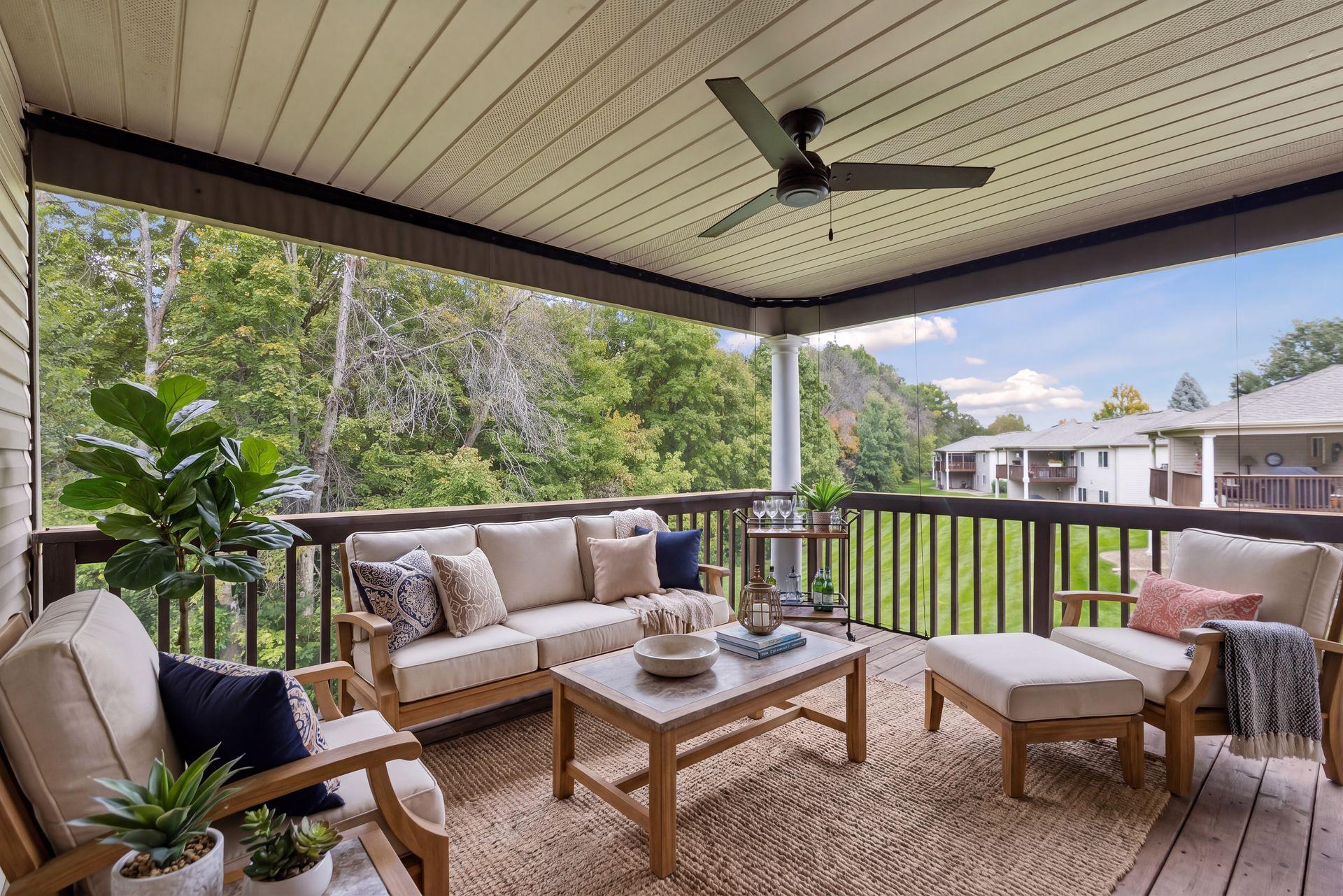 Relax on the covered deck while enjoying mature trees, expansive green space, and removable screens for added seasonal comfort.