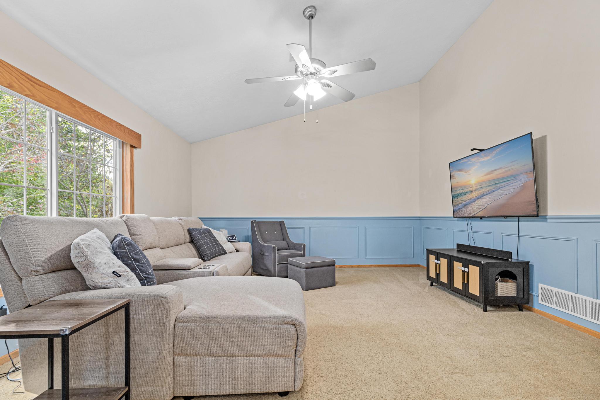 Main level living room with vaulted ceilings