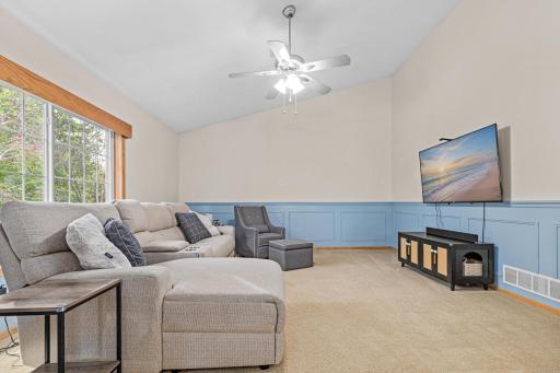 Main level living room with vaulted ceilings