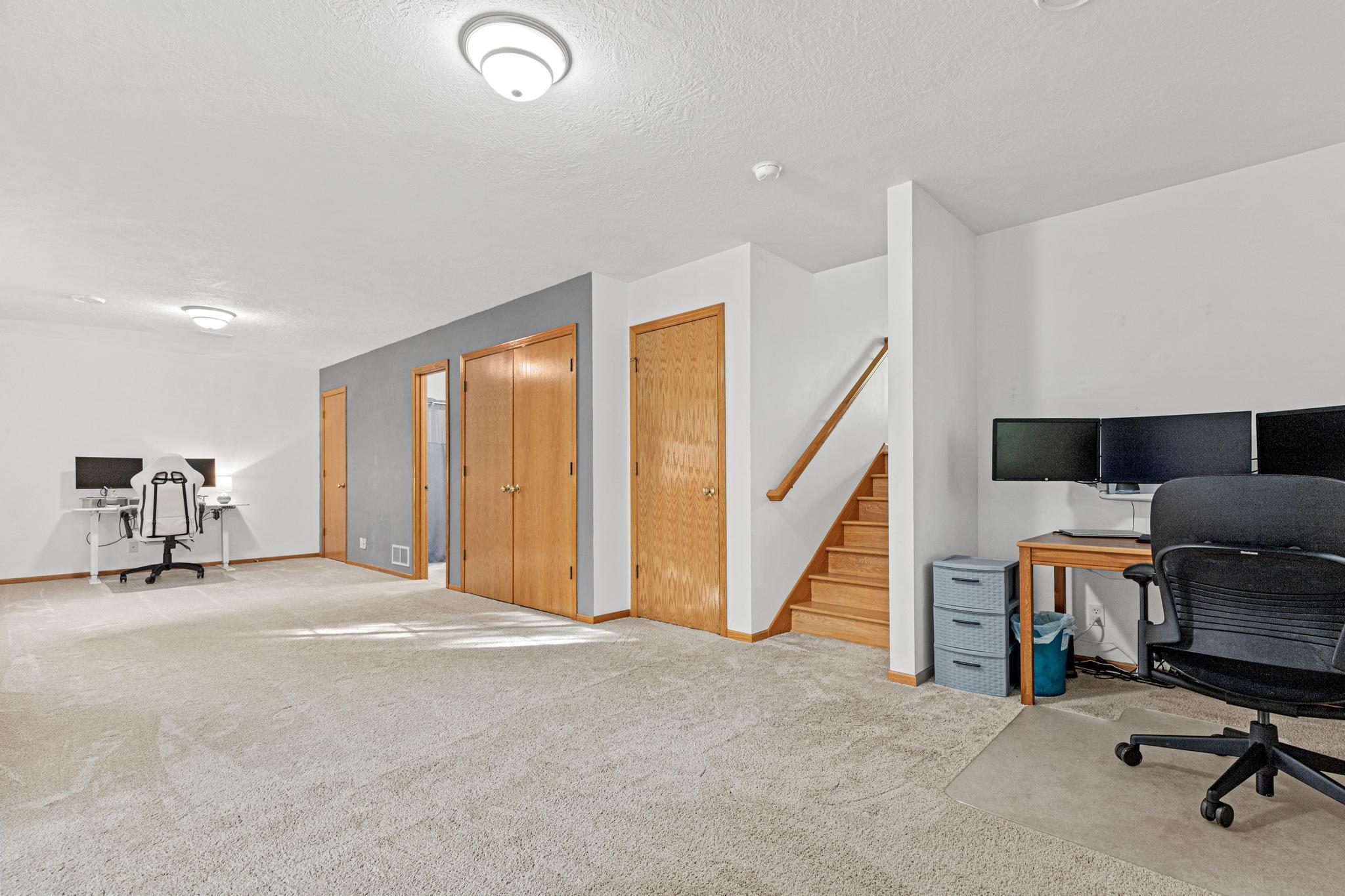 Lower level family room, you could easily frame half of it to make a 3rd bedroom