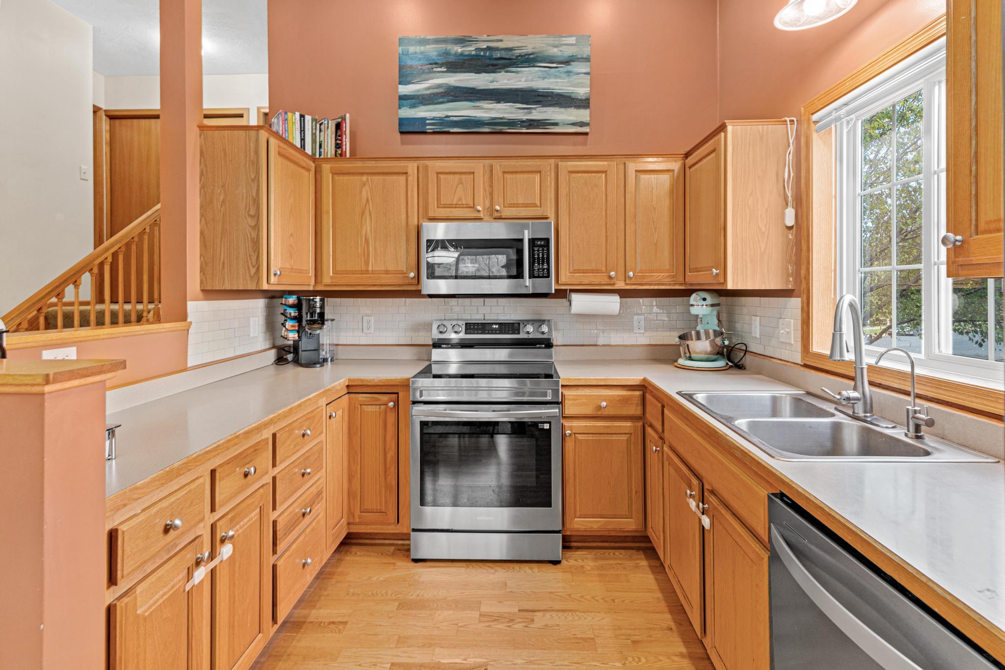 Large kitchen with plenty of counter space and cabinets.
