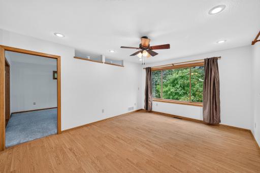 Informal dining area with hard surface floors, natural light, and a ceiling fan.