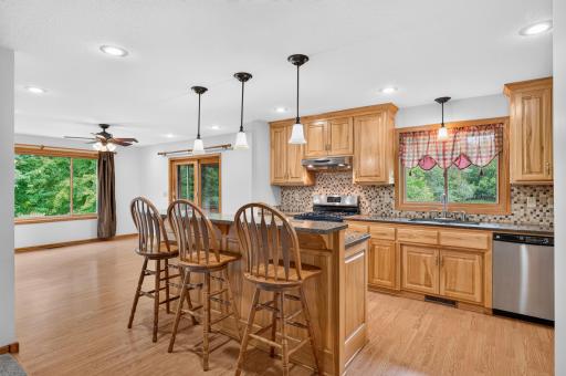 Gather around the two-tier center island with convenient seating for casual meals.