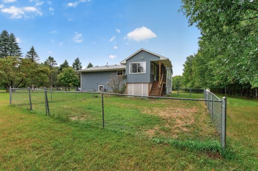 A small fenced-in area offers a convenient section of yard just outside the home.