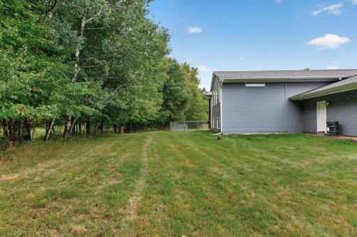 Five acres provide a beautiful mix of open lawn and mature trees.