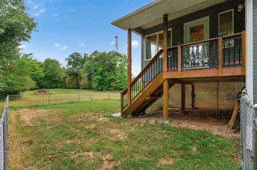 Step outside from the three-season porch to enjoy the quiet acreage.