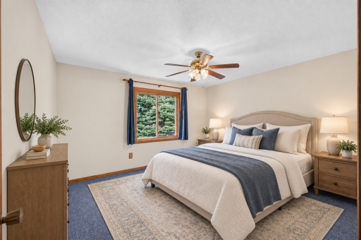 Virtually staged primary bedroom featuring a comfortable layout and soft neutral palette.