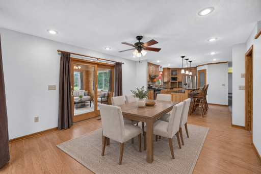Virtually staged to show how comfortably the dining area accommodates a full-size table.