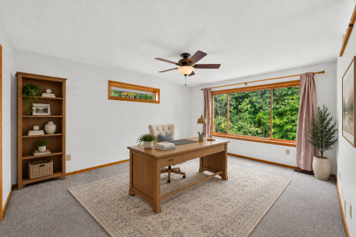 Virtually staged bonus roomâan ideal setup for a home office, study, or additional sitting area.