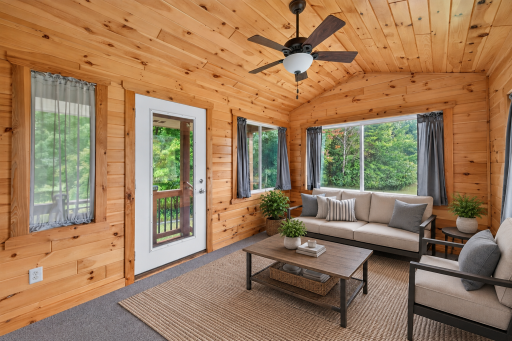 Virtually staged three-season porchâa cozy place to unwind.
