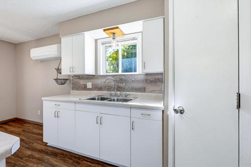 The kitchen features a pantry closet. A window above the sink provides you with a view.