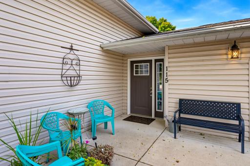 A concrete patio situated at the front of the house welcomes you to 115 E Nelson St, Litchfield.