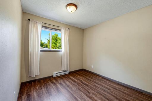 One of two main floor bedrooms. Both main floor bedrooms include a walk-in closet.