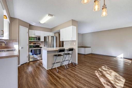 A view of the kitchen from the dining area.