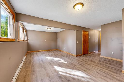 The spacious family room features daylight windows to let in tons of natural light.