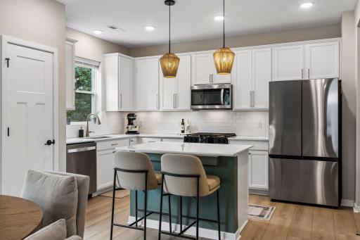 Well-appointed kitchen with center island and seating.