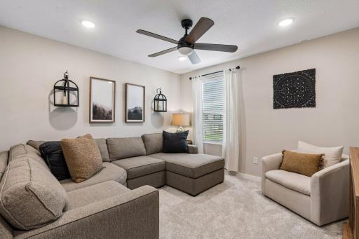 Cozy and relaxing upper level loft with upgraded ceiling fan.