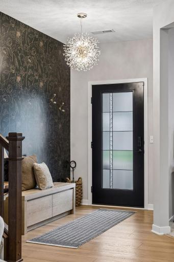 Loevely front entry with upgraded foyer lighting.