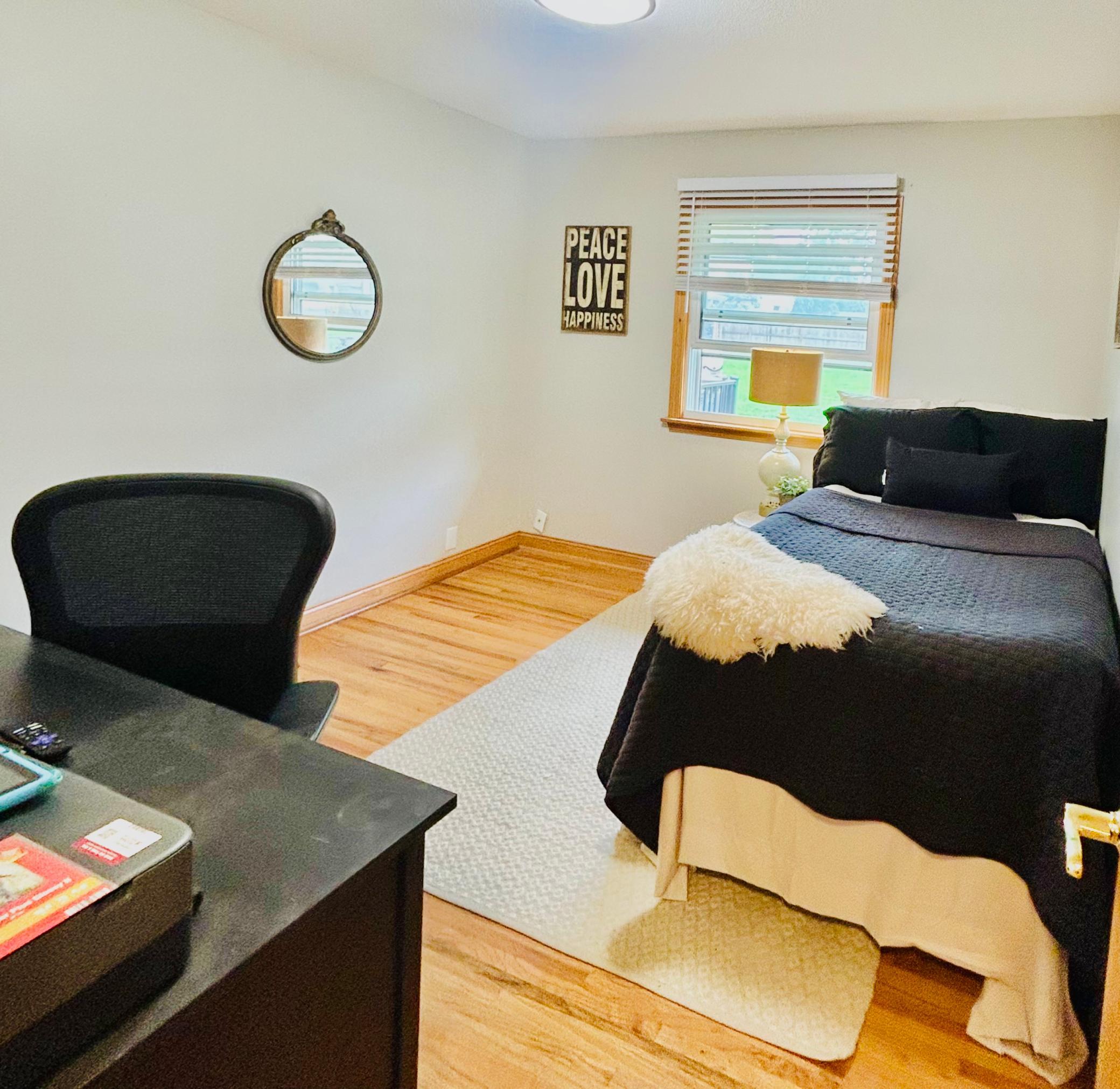 One of three bedrooms on the main level! This one is big enough to do double duty as an office too!