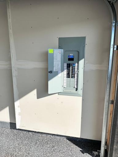 Elec Panel is in the garage...easy to add a 50Amp outlet for EV charging