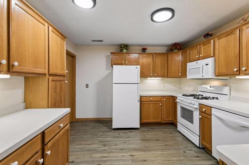 Large kitchen with plenty of storage and new flooring!