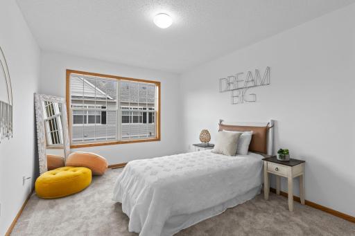 Bedroom two is generous in size with ample closet space and a large window.