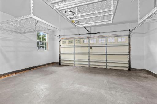 The spacious attached 2-car garage with overhead storage.