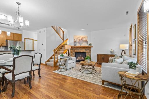 Step inside to a bright, open-concept main level featuring brand-new warm-toned luxury plank flooring throughout.