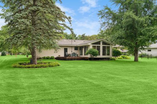 Relax and unwind on the deck overlooking the backyard.