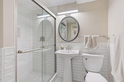 Beautifully tiled walk-in shower in the lower-level bathroom.