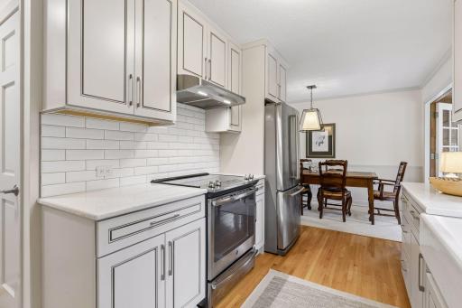 Another view of the updated kitchen with convenient access to the lower level and 2 car garage.