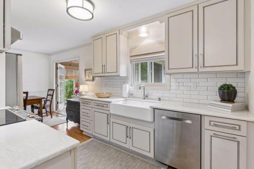 Farmhouse sink complemented by Cambria countertops.