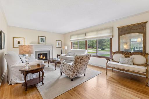 Living room with a wood burning fireplace.