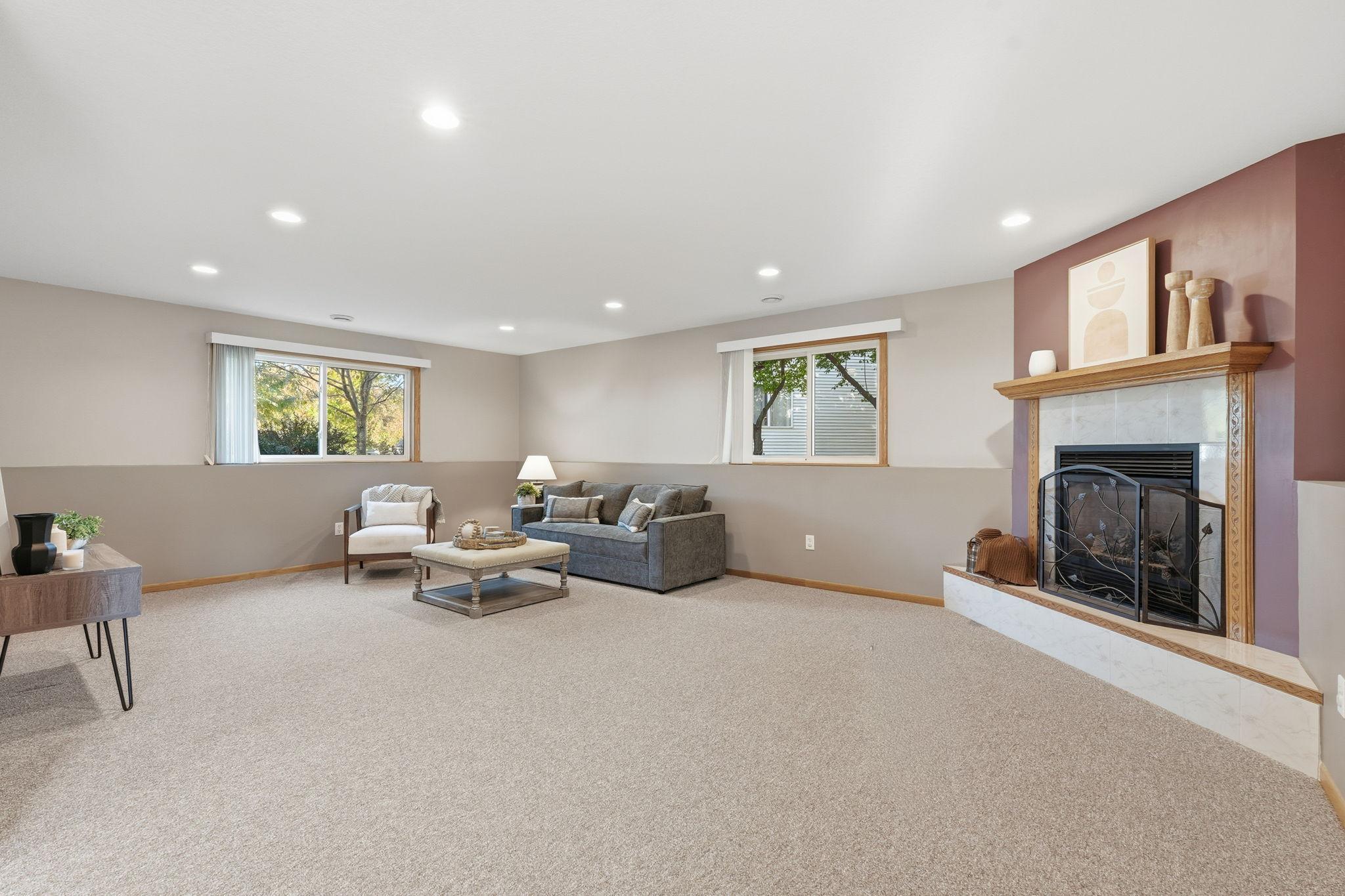 Lower level family room with gas fireplace
