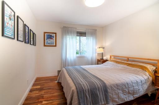 With West and North windows, this main level bedroom is spacious and might even help you sleep in a little longer.