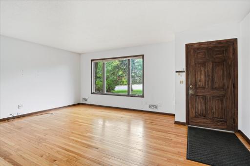 Walk in to your beautiful living area that is boasted with natural lighting and has hardwood floors.