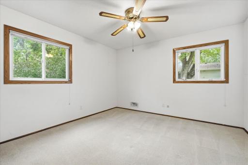 Another bedroom on the main level which has a generous amount of natural lighting.