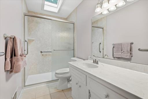 Bathroom on the main level that has a great amount of cabinet and countertop space.