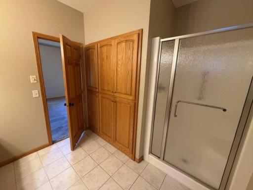 42 primary three quarter bathroom with massive cabinet storage.jpg