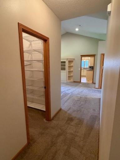 27 hallway storage closet with built in shelving.jpg