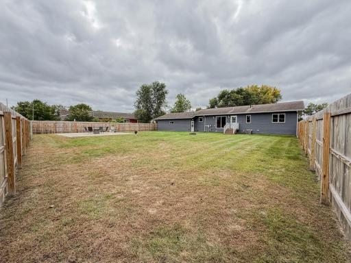 New Fence in backyard with patio area