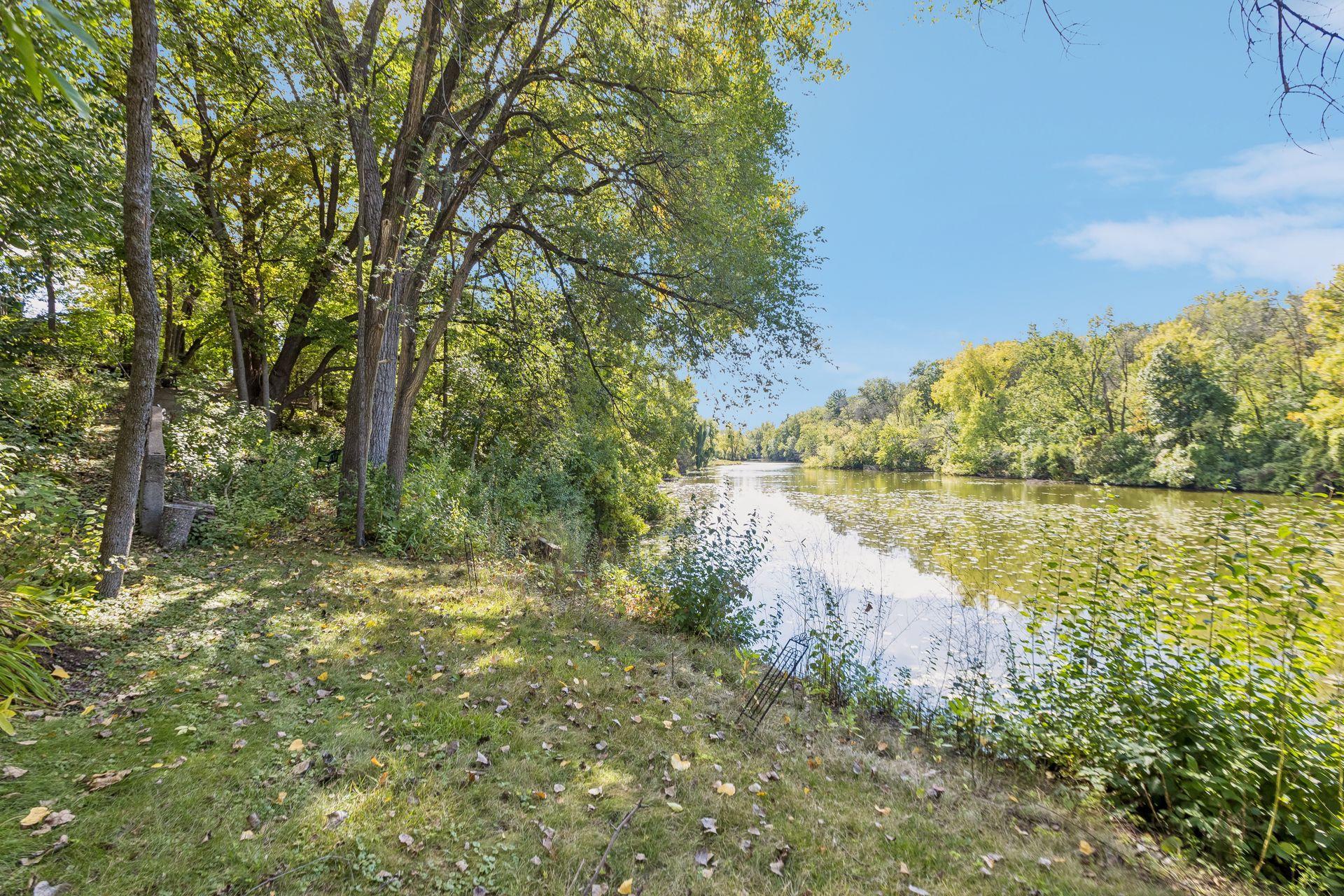 Enjoy a peaceful lakeside lifestyle with serene views of Melody Lake and a private setting surrounded by mature trees.
