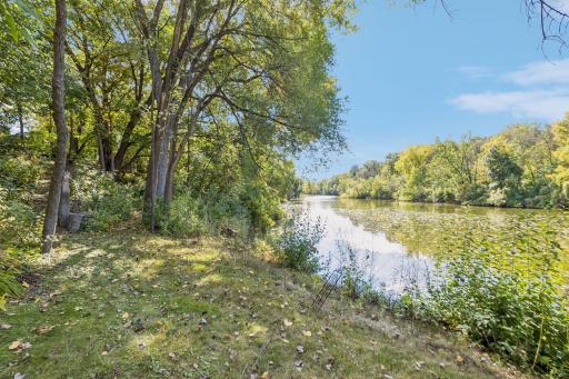 Enjoy a peaceful lakeside lifestyle with serene views of Melody Lake and a private setting surrounded by mature trees.