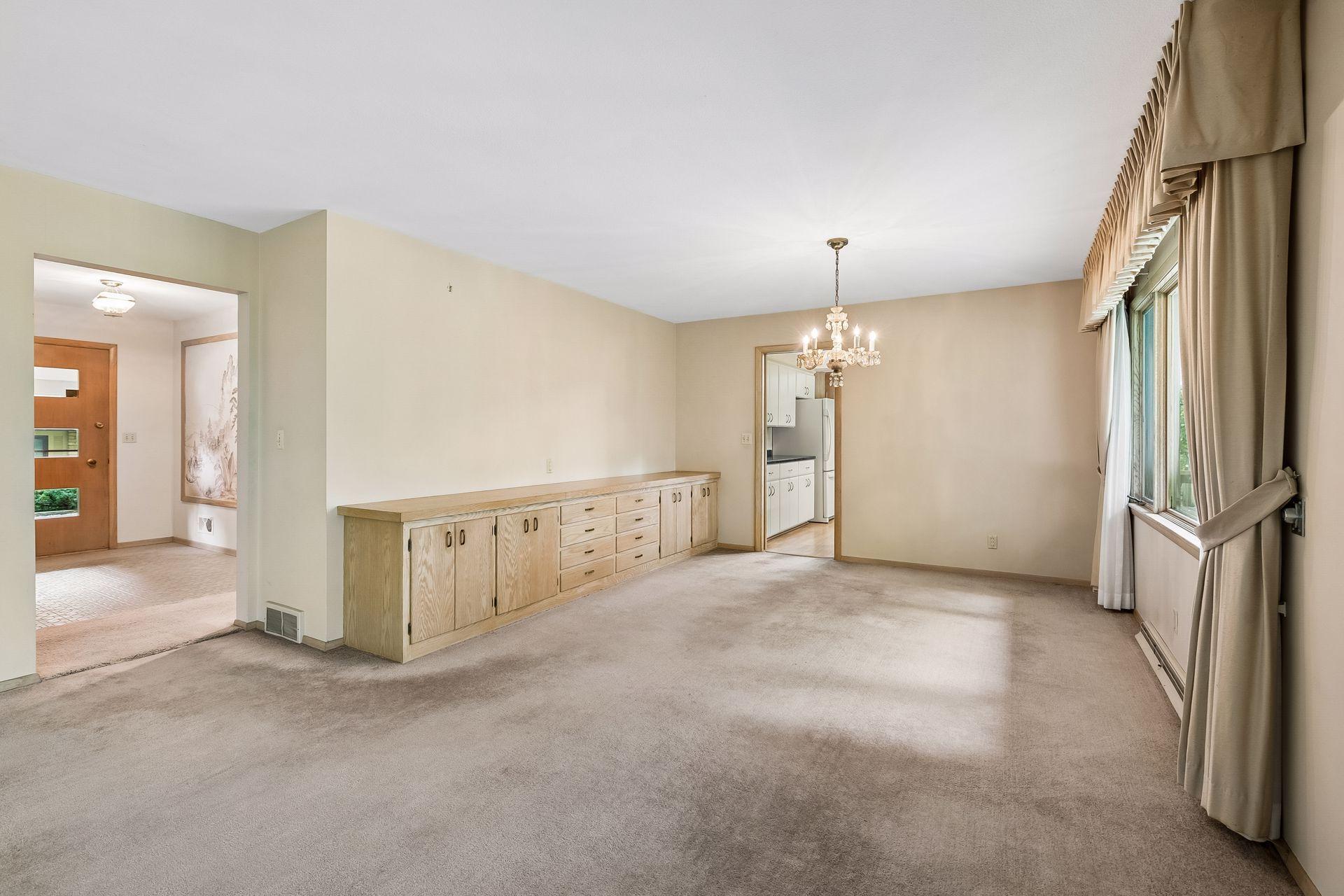 Spacious dining area features a built-in buffet for convenient serving and storage.