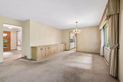 Spacious dining area features a built-in buffet for convenient serving and storage.